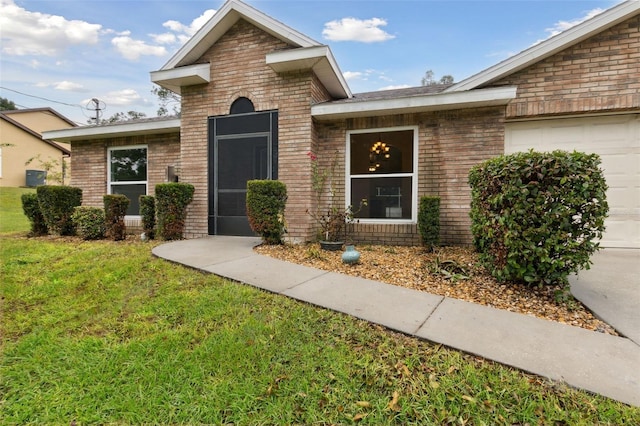 exterior space with a garage and a yard