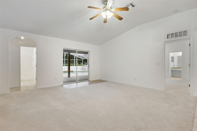 unfurnished room with light carpet, ceiling fan, and vaulted ceiling