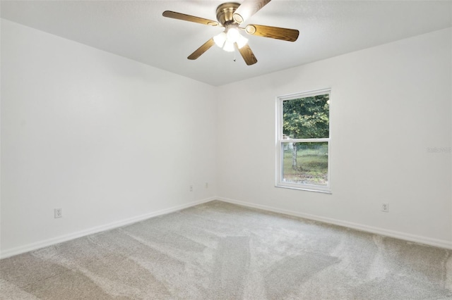 empty room featuring carpet flooring and ceiling fan