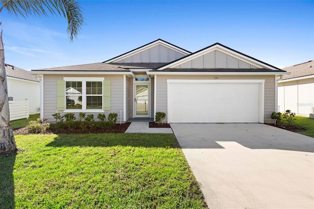 ranch-style house with a front lawn and a garage