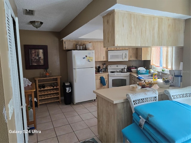 kitchen featuring kitchen peninsula, a textured ceiling, light brown cabinetry, sink, and white appliances