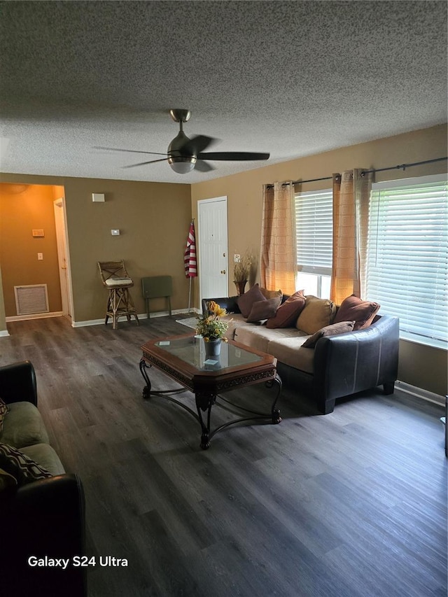1461 N Felton St, Deltona, FL 32725 - living area featuring a textured ceiling, baseboards, wood finished floors, and ceiling fan