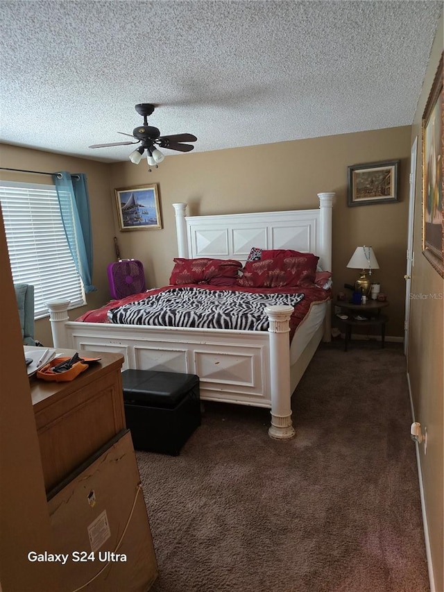 carpeted bedroom with ceiling fan and a textured ceiling