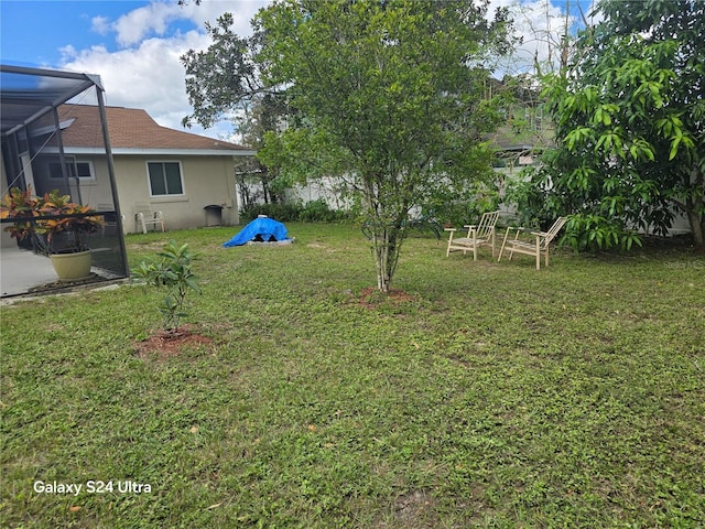 1461 N Felton St, Deltona, FL 32725 - view of grassy yard with glass enclosure