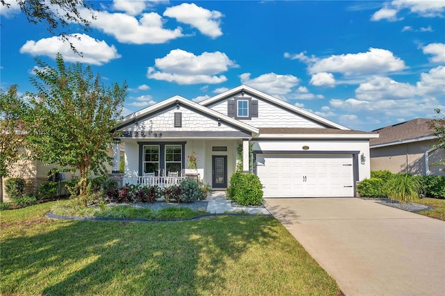 craftsman house featuring a porch, a front yard, and a garage