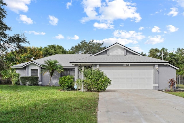 ranch-style home with a garage and a front lawn