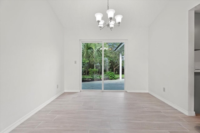 unfurnished dining area with a notable chandelier and light hardwood / wood-style flooring