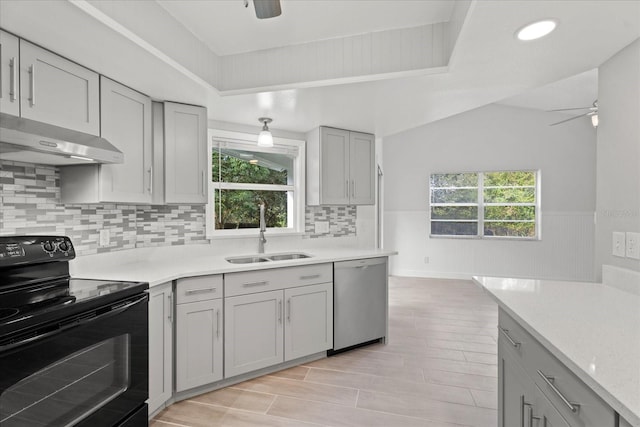 kitchen featuring black range with electric stovetop, ceiling fan, dishwasher, light hardwood / wood-style floors, and sink