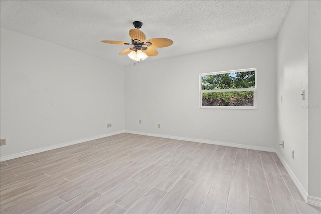 unfurnished room with light hardwood / wood-style flooring, a textured ceiling, and ceiling fan