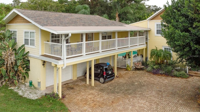 rear view of house with a garage