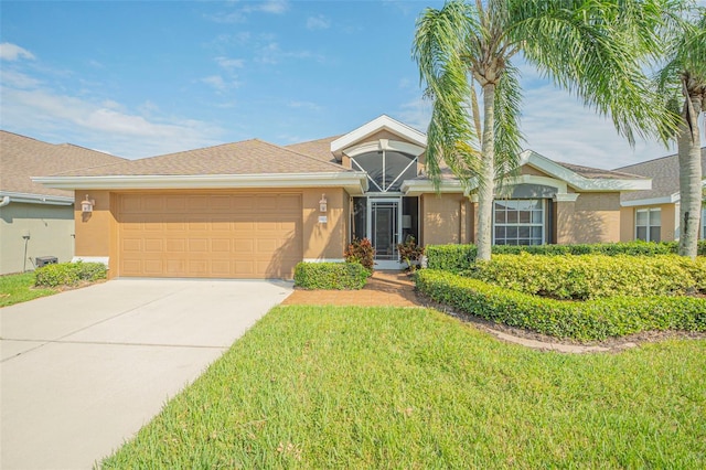 single story home featuring a front lawn and a garage