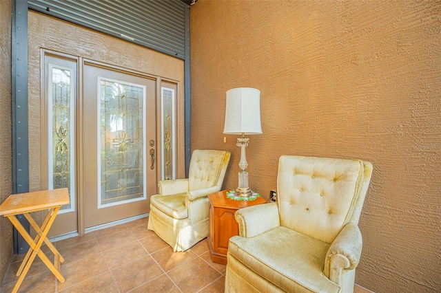 living area featuring tile patterned flooring