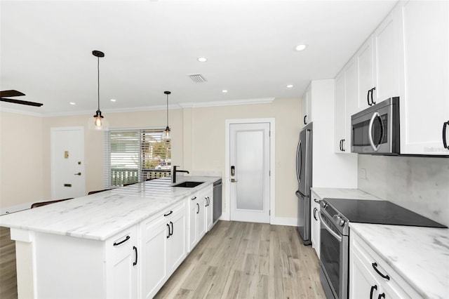 kitchen with light stone countertops, ceiling fan, stainless steel appliances, light hardwood / wood-style flooring, and white cabinets