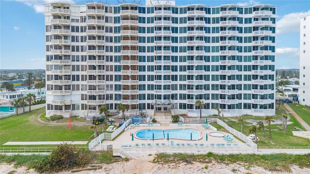 view of building exterior with a community pool