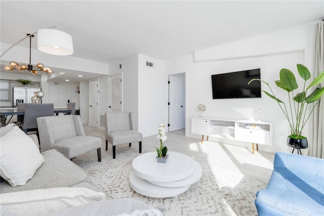 living room featuring a chandelier