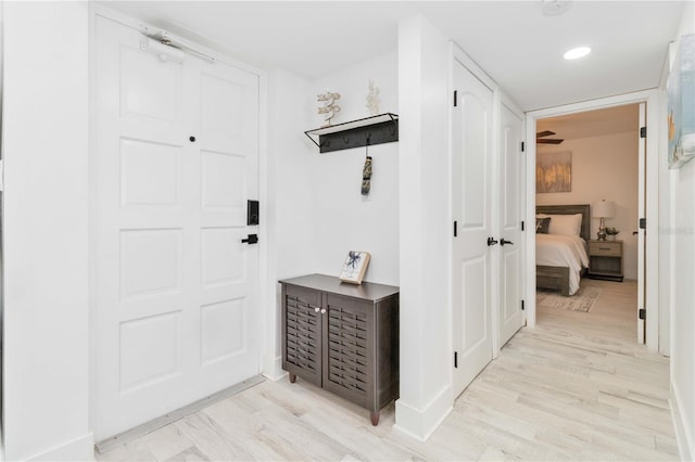 hallway featuring light hardwood / wood-style flooring