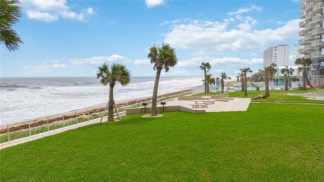 exterior space with a water view and a yard