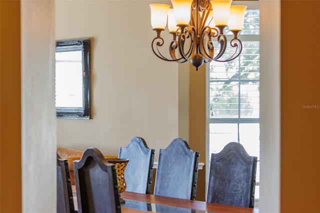 dining space with a notable chandelier