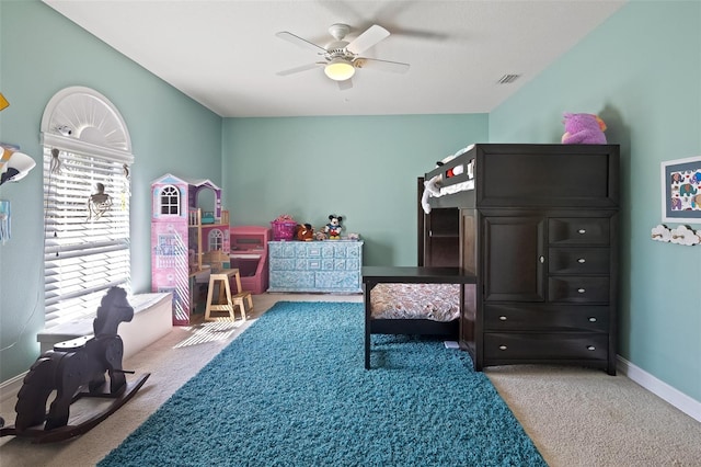 carpeted bedroom featuring ceiling fan