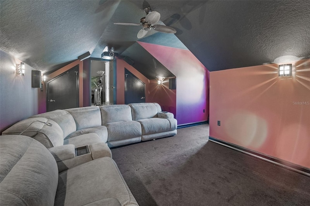 carpeted home theater with lofted ceiling, a textured ceiling, and ceiling fan