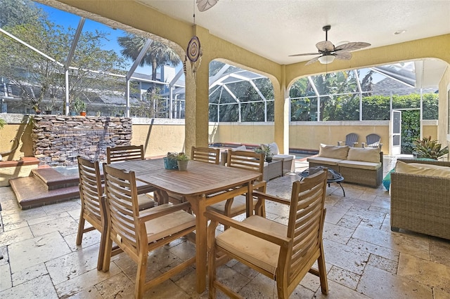 view of patio featuring ceiling fan, a lanai, and an outdoor hangout area