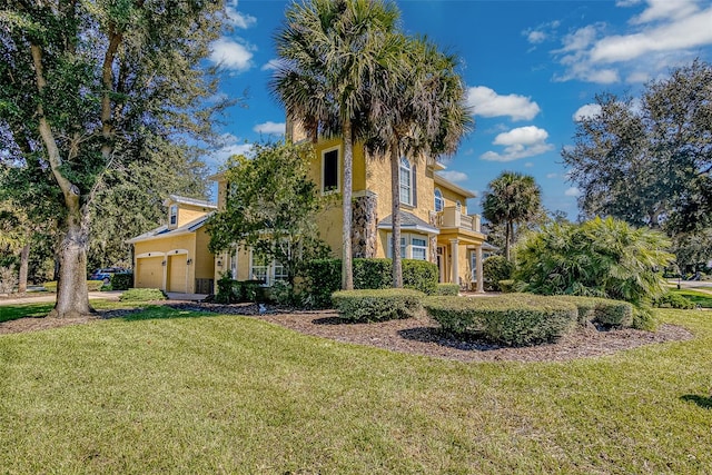 view of front of home with a front lawn and a garage