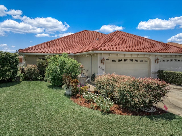 view of side of home featuring a yard and a garage