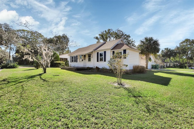 view of side of property featuring a yard