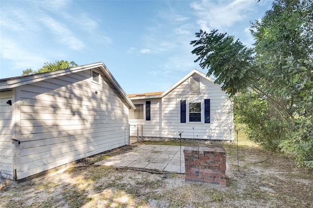 back of house featuring a patio area