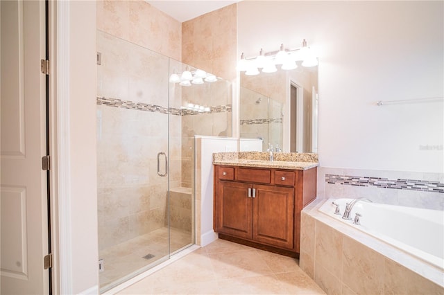 bathroom featuring vanity, tile patterned flooring, and plus walk in shower