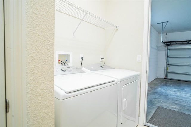 laundry area with washing machine and dryer