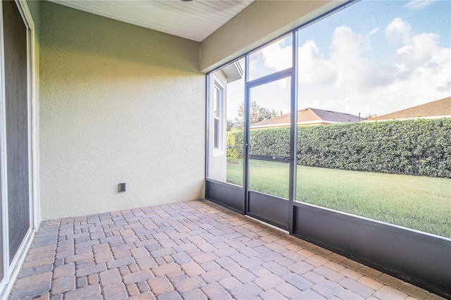 unfurnished sunroom featuring plenty of natural light