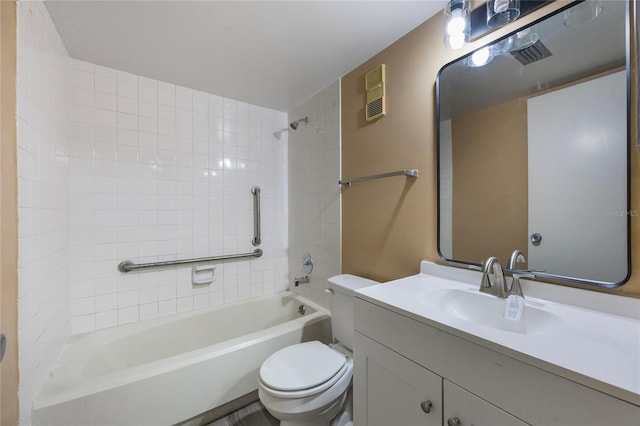 full bathroom featuring vanity, toilet, and tiled shower / bath combo