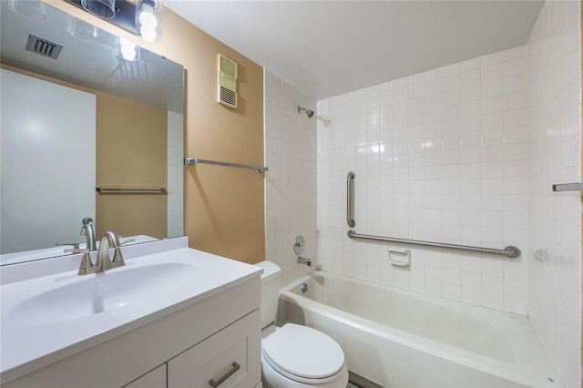 full bathroom featuring vanity, toilet, and tiled shower / bath