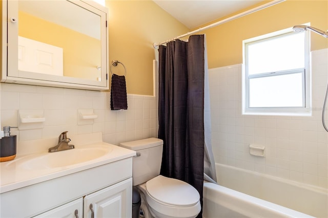 full bathroom featuring vanity, toilet, tile walls, and shower / tub combo