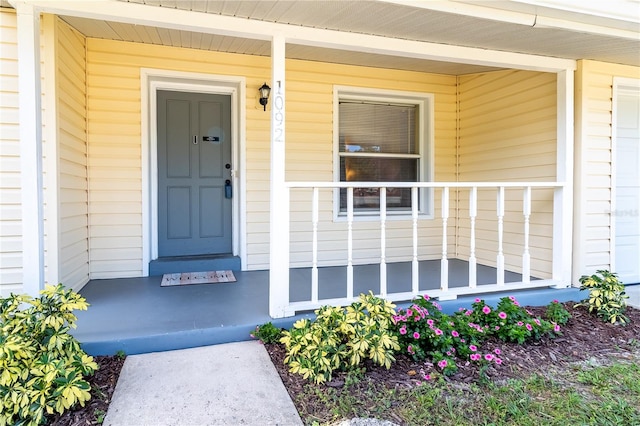 doorway to property featuring a porch