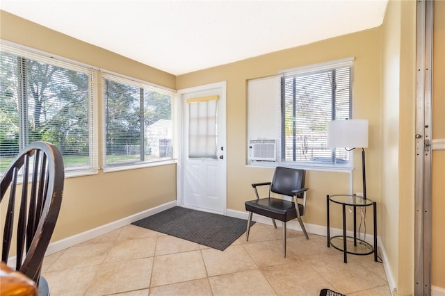 doorway to outside with cooling unit and light tile patterned floors