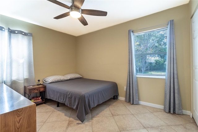 bedroom featuring ceiling fan and light tile patterned floors