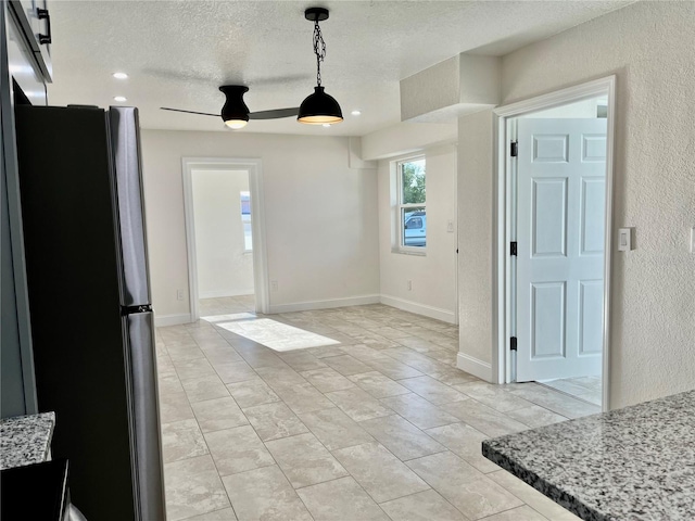 dining area with a textured ceiling