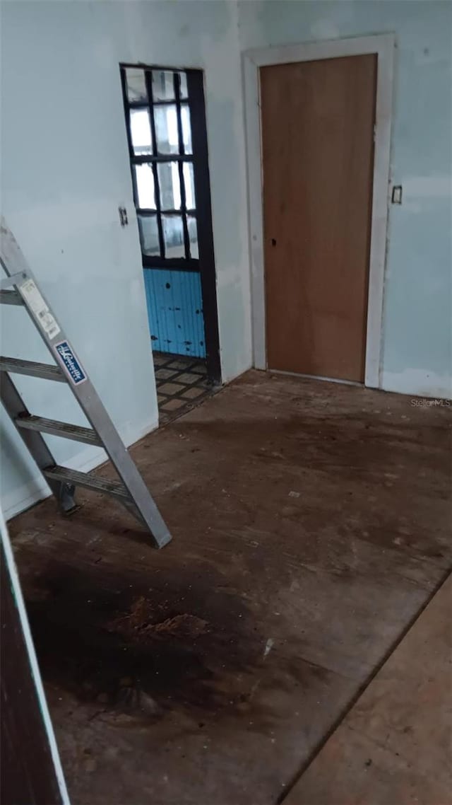 corridor with hardwood / wood-style floors