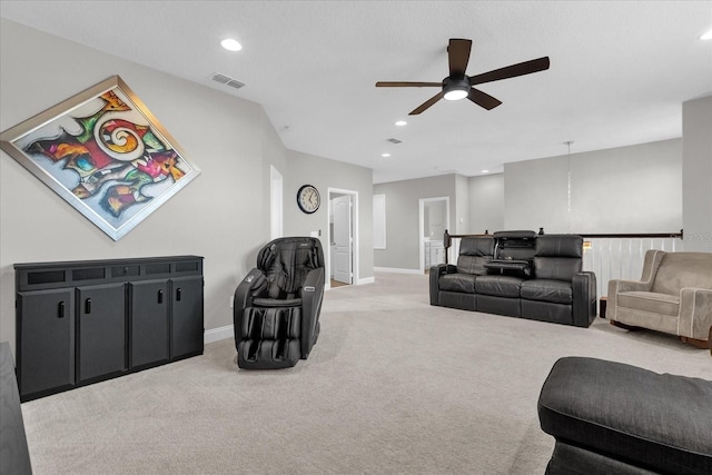 living room with light colored carpet and ceiling fan