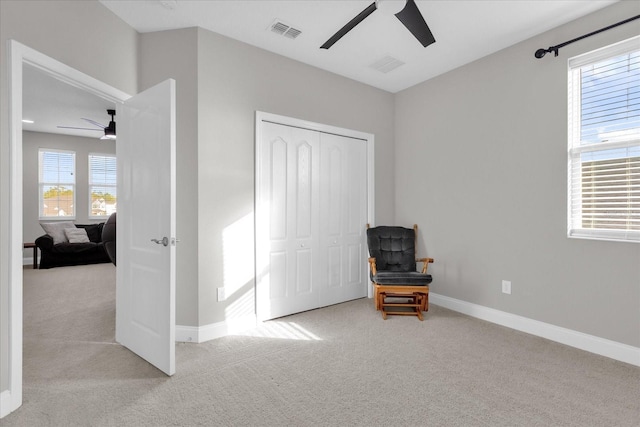 interior space with a closet and ceiling fan