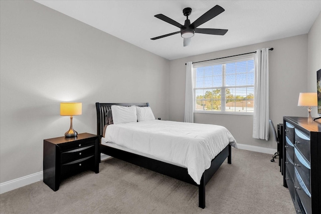 bedroom with light colored carpet and ceiling fan