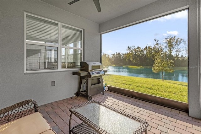 sunroom with a water view