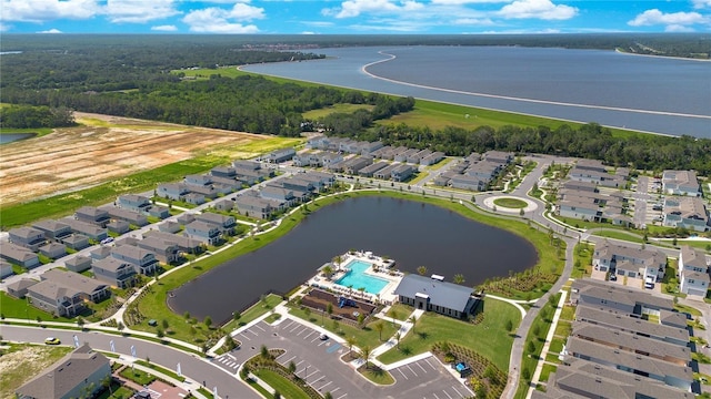 birds eye view of property with a water view