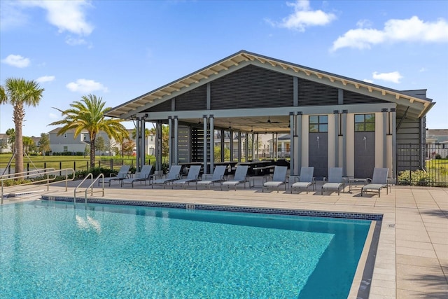 view of pool featuring a patio area and ceiling fan