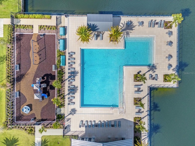 birds eye view of property with a water view