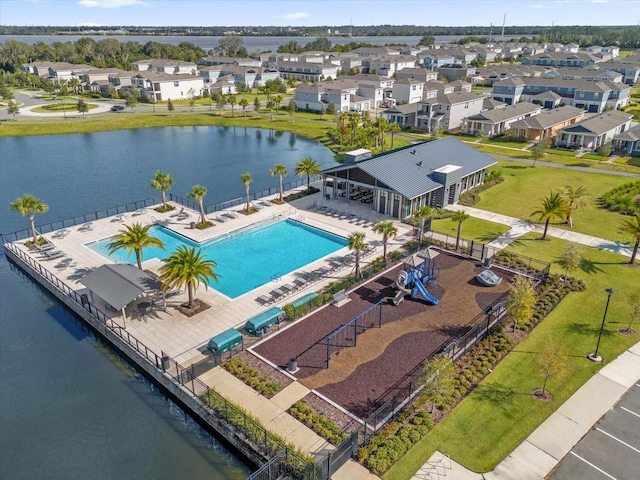 birds eye view of property with a water view