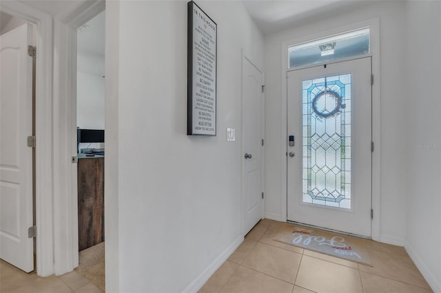 foyer entrance with light tile patterned floors