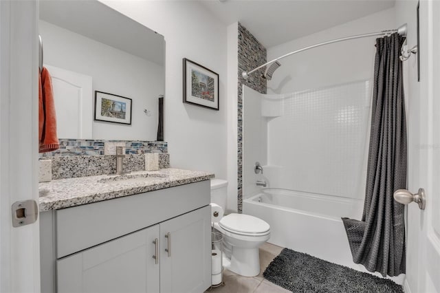 full bathroom featuring tile patterned floors, shower / tub combo with curtain, vanity, and toilet